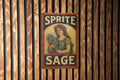Rustic Americana Sprite Sage Tin Sign – Hand-Painted Weathered Metal Wall Art, Vintage Red Navy Cream, Chipped Paint Decor — photo 1