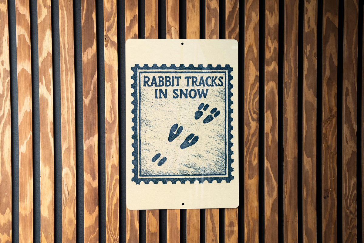 Rabbit Tracks in Snow Metal Sign – Rustic Winter Stamp Style Wall Art, Cabin Decor, Animal Footprint Sign for Lodge or Home — photo 1