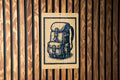 Hiking Backpack Metal Sign – Rustic Stamp Style Wall Art for Campers, Outdoorsy Decor for Cabin, Lodge or Adventure Room — photo 1