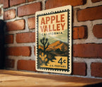 Apple Valley California Postage Stamp Metal Sign – Retro Travel Art Featuring Desert Scene and Vintage Lettering — photo 1
