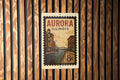 Aurora Illinois Metal Sign – Retro Postage Stamp Design Featuring Historic Cityscape and Iconic Landmarks — photo 1