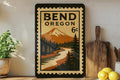 Bend Oregon Metal Sign – Retro Postage Stamp Design Featuring Mountains, Trees, and Outdoor Scenery — photo 1