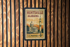 Huntsville Alabama Metal Sign Featuring Retro Postage Stamp Design with Rocket, Stars, and City Skyline Scene — photo 2