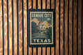 League City Texas Metal Sign – Vintage Postage Stamp Design Featuring Cityscape and Iconic Local Landmarks — photo 1