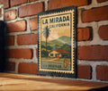 La Mirada California Metal Sign – Retro Postage Stamp Design Featuring City Name and Scenic Local Elements — photo 1