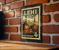 Lehi Utah Metal Sign Featuring Retro Postage Stamp Design with Mountain Scenery and Historic Downtown Elements — photo 1