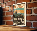Milpitas California Metal Sign Featuring Retro Postage Stamp Design with Cityscape and Landmark Illustration — photo 1
