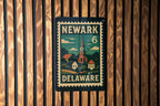 Newark Delaware Metal Sign Featuring Retro Postage Stamp Design with Cityscape and Vintage Travel Theme — photo 1