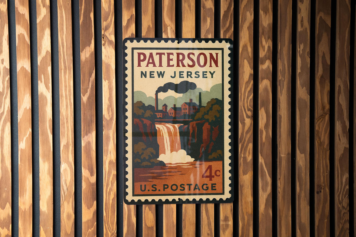 Paterson New Jersey Metal Sign Featuring Retro Postage Stamp Design with Cityscape and Historic Landmarks — photo 1