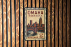Omaha Nebraska Metal Sign Featuring Retro Postage Stamp Design with Cityscape and Iconic Landmarks — photo 1