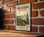Owensboro Kentucky Metal Sign Featuring Retro Postage Stamp Design with Cityscape and Local Landmarks — photo 3