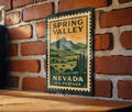 Spring Valley Nevada Metal Sign Featuring Retro Postage Stamp Design of Scenic Desert Landscape and Mountain View — photo 1