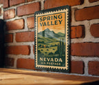 Spring Valley Nevada Metal Sign Featuring Retro Postage Stamp Design of Scenic Desert Landscape and Mountain View — photo 1