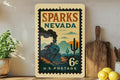 Sparks Nevada Metal Sign Featuring Retro Postage Stamp Design with Trains, Mountains, and Vintage Cityscape — photo 1
