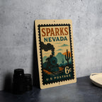 Sparks Nevada Metal Sign Featuring Retro Postage Stamp Design with Trains, Mountains, and Vintage Cityscape — photo 4