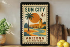 Sun City Arizona Metal Sign Featuring Vintage Postage Stamp Design with Desert Scene and Palm Trees — photo 1