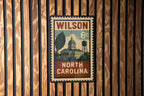 Wilson North Carolina Metal Sign – Retro Postage Stamp Design Featuring Town Landmark and Scenic Details — photo 3