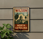 Wilson North Carolina Metal Sign – Retro Postage Stamp Design Featuring Town Landmark and Scenic Details — photo 5